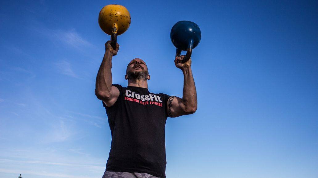 Man doing kettlebell workout