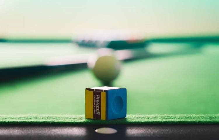 billiard chalk on table edge