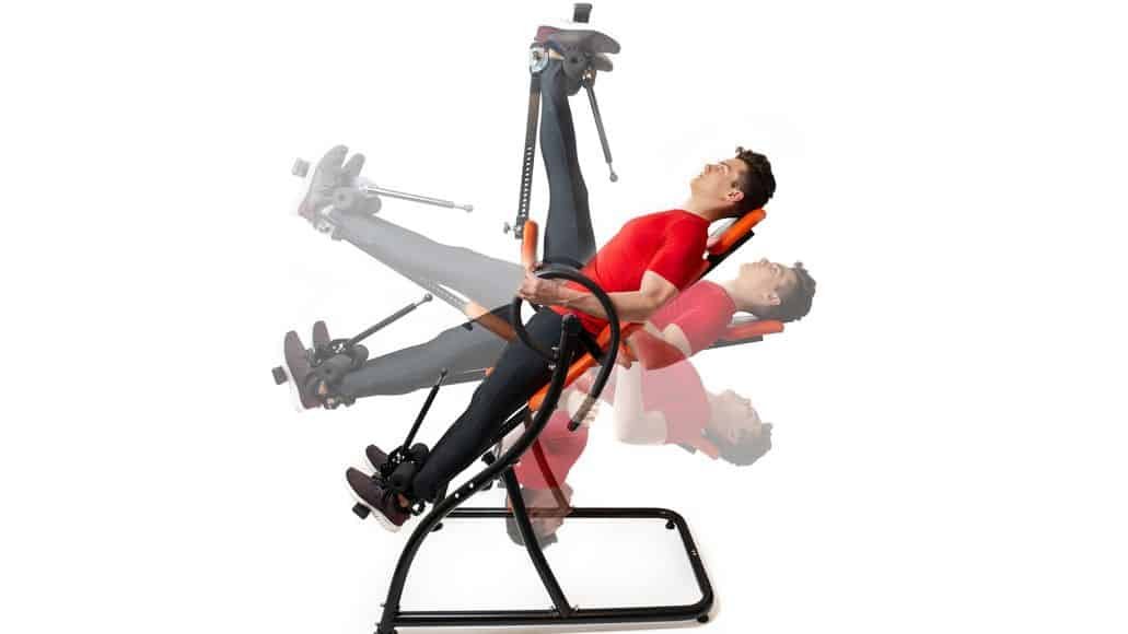  man decompressing spine on inversion table